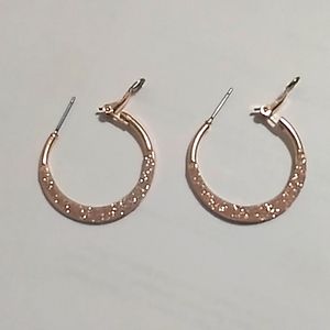 Rose gold colored earrings